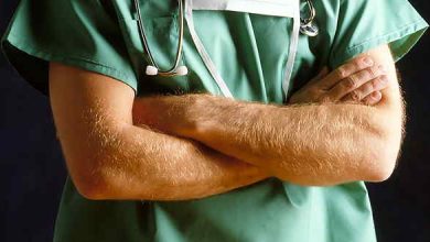 surgeon with folded arms